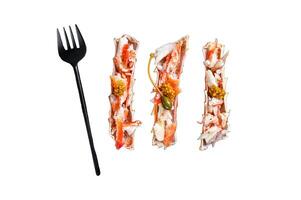 Crab leg meat in a sheel with herbs Isolated on white background, top view. photo