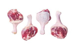 Raw Duck legs drumsticks on butcher table. Isolated on white background, top view. photo