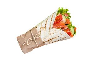 Wrap roll sandwich with fish salmon and vegetables. Isolated on white background. photo