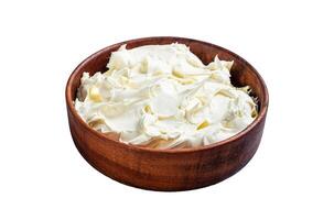 Traditional Mascarpone cheese in wooden bowl. Isolated on white background, top view. photo