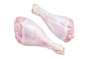 Raw turkey legs on a butcher table. Isolated, white background. photo