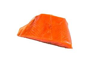 Smoked salmon fillet on a wooden table. Isolated on white background. photo