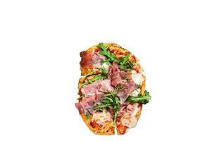 Sliced pizza with prosciutto parma ham, arugula and parmesan cheese on a wooden board. High quality Isolate, white background. photo