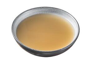 Bone meat chicken broth in a plate. Isolated on white background. Top view. photo