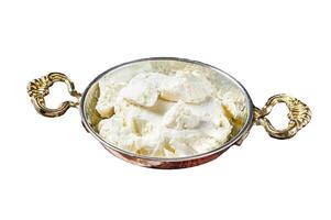 Goat and sheep cheese in a pan with olives and rosemary. Isolated on white background, top view. photo