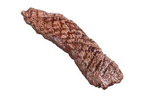 Grilled meat steak Machete skirt on a rack. Isolated, white background. photo