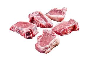 Fresh Raw lamb loin chops steaks, cutlets on butcher board with meat cleaver. Isolated on white background, top view. photo