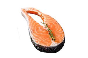 Raw salmon fish steak Isolated on white background. Top view. photo