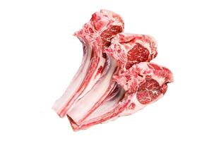 Lamb raw cutlets chops with salt, pepper and garlic. Isolated on white background, top view. photo