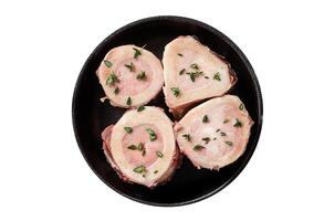 Fresh Raw beef Marrow bones in pan for cooking broth. Isolated, white background. Top view. photo