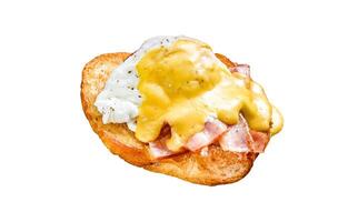 Brioche sandwich with bacon, egg Benedict and hollandaise sauce. Isolated on white background. photo