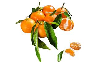 Mandarin oranges or tangerines fruits with leaves on wooden board. Isolated on white background. photo