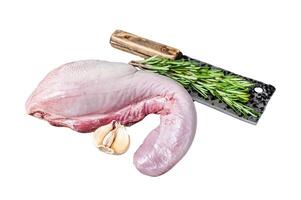 Uncooked Raw beef or veal tongue on butcher board with meat cleaver. Isolated on white background. photo