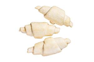 Raw uncooked homemade croissant on a rustic plate. Isolated on white background, top view. photo