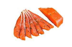 Salted salmon fillet slices in a wooden tray with thyme. Isolated on white background, top view. photo