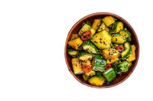 Pai huang gua Chinese Smashed Cucumber salad. Isolated on white background. photo
