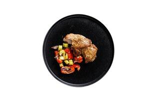 Baked Turkey thigh with vegetables. Isolated on white background. photo