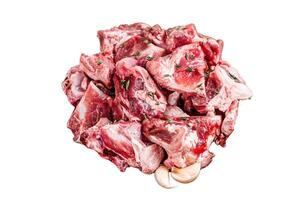Raw mutton meat diced for goulash or stew with bone Isolated on white background, top view. photo