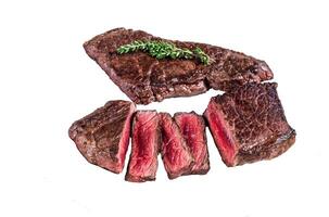 Roasted sliced rump beef meat steak Isolated on white background, top view. photo