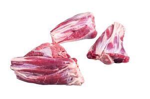 Uncooked Raw lamb shanks, mutton meat on kitchen table. Isolated on white background photo