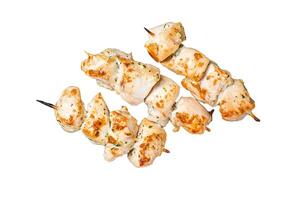 Chicken shish kebab, grilled skewers with herbs and spices on a rack. Isolated, white background. photo