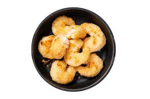 Fried Breaded Shrimps Prawns in a pan. Isolated on white background. photo