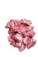 Fresh Raw Diced pork cubs meat with spices on a wooden butcher board. High quality Isolate, white background. photo