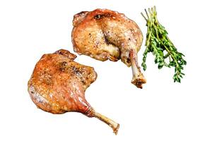 Roasted duck leg confit with cranberrie sauce. Isolated on white background, Top view. photo
