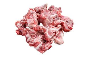 Uncooked Raw meat diced for stew on a butcher board. Isolated, white background. photo