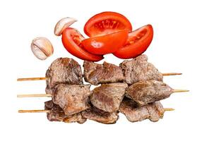 Bbq lamb meat on wooden skewers with vegetables Isolated on white background, top view. photo