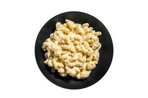 Mac and cheese. macaroni pasta in cheesy sauce. Isolated on white background. photo