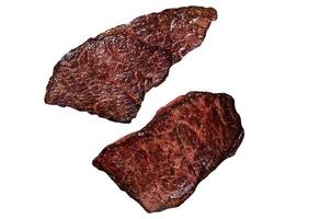 Grilled denver beef meat steak in a pan with rosemary. Isolated on white background. photo