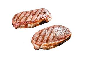Grilled meat Top Blade steaks Isolated on white background. Top view. photo