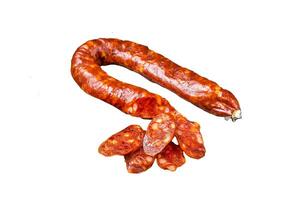 Sliced Chorizo sausage, slices of dry cured pork with herbs and spices. Isolated, white background. photo