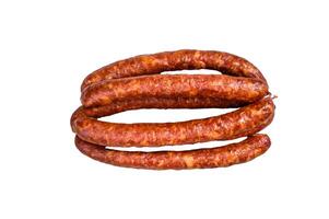 Hot Smoked sausages on a rustic table. Isolated on white background. photo