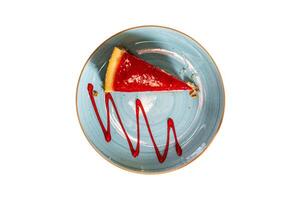 Classic New York strawberries and lemon Cheesecake on a wooden table in cafe. Isolated, white background. Top view. photo