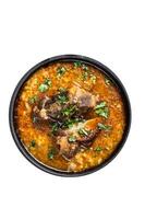 Kharcho soup with beef meat, rice, tomatoes and spices in a pan. High quality Isolate, white background. photo