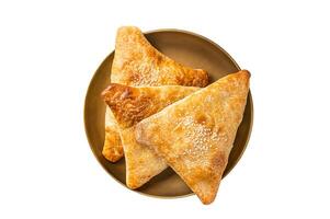 Samsa with chicken and cheese, samosa oriental pies. Isolated on white background. photo