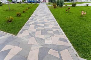 A beautifully designed walkway in a park featuring a geometric pattern photo