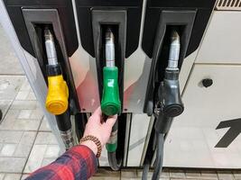 Explore the Refueling Station, showcasing various fuel choices such as diesel and gasoline, with gas pump nozzles as the central focus photo