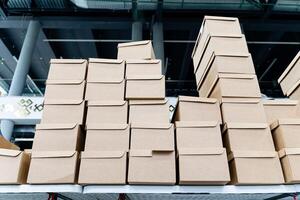 A collection of stacked cardboard boxes neatly organized within a modern storage facility designed for efficient inventory management and logistics photo