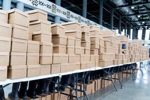 In a contemporary warehouse environment, there are large stacks of unpacked boxes that are fully prepared and ready for distribution photo