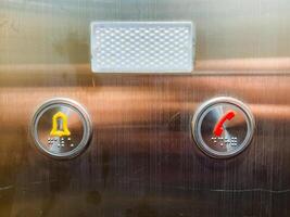 The elevator is equipped with both a bell for signaling and a button designated for telephone communication, enhancing user accessibility and convenience during operations photo