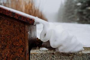 A birdhouse with snow on it photo