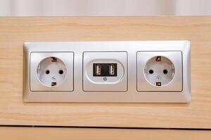 An electrical outlet with two sockets on it photo