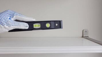 Utilizing a Leveling Tool for Accurate Installation of Shelves and Racks video