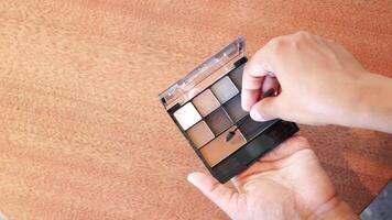 Applying Beautiful Eyeshadow from a Colorful Makeup Palette for a Stunning Look video