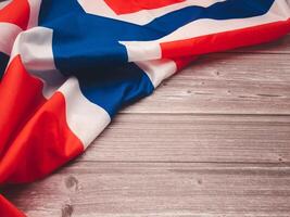 Top view of the Norway flag on a wooden table with copy space for text photo