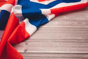 Top view of the Norway flag on a wooden table with copy space for text photo