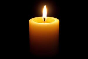 A candle is lit and is sitting on a table photo